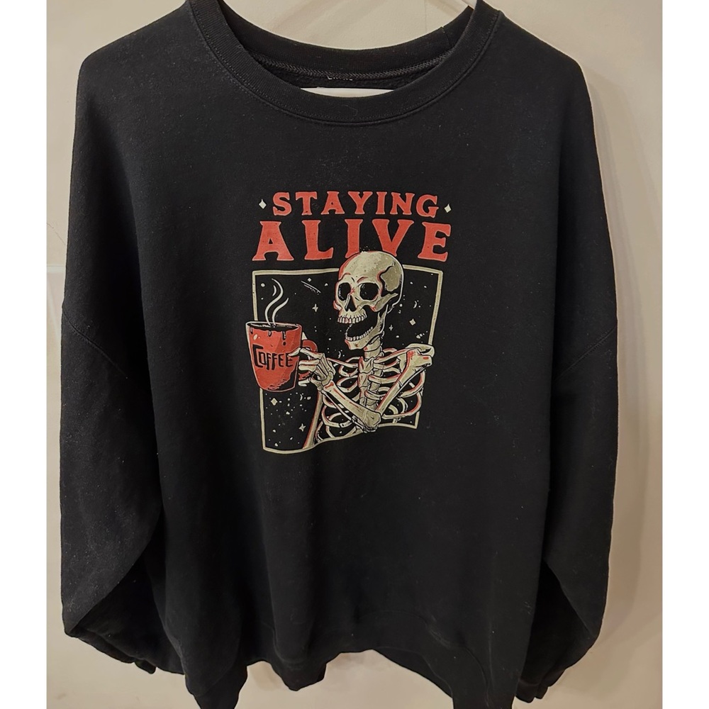 Staying Alive skeleton coffee graphic sweatshirt